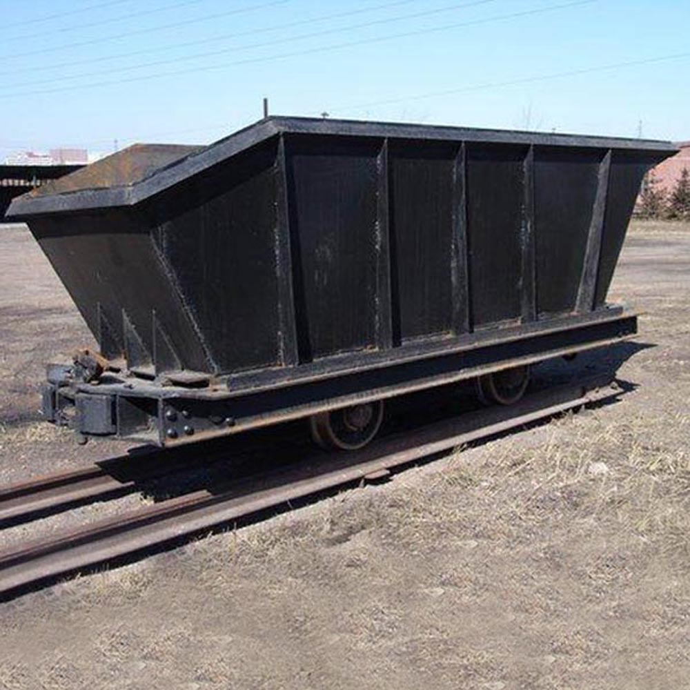 How Is The Bottom Dump Mining Cart Unloaded?